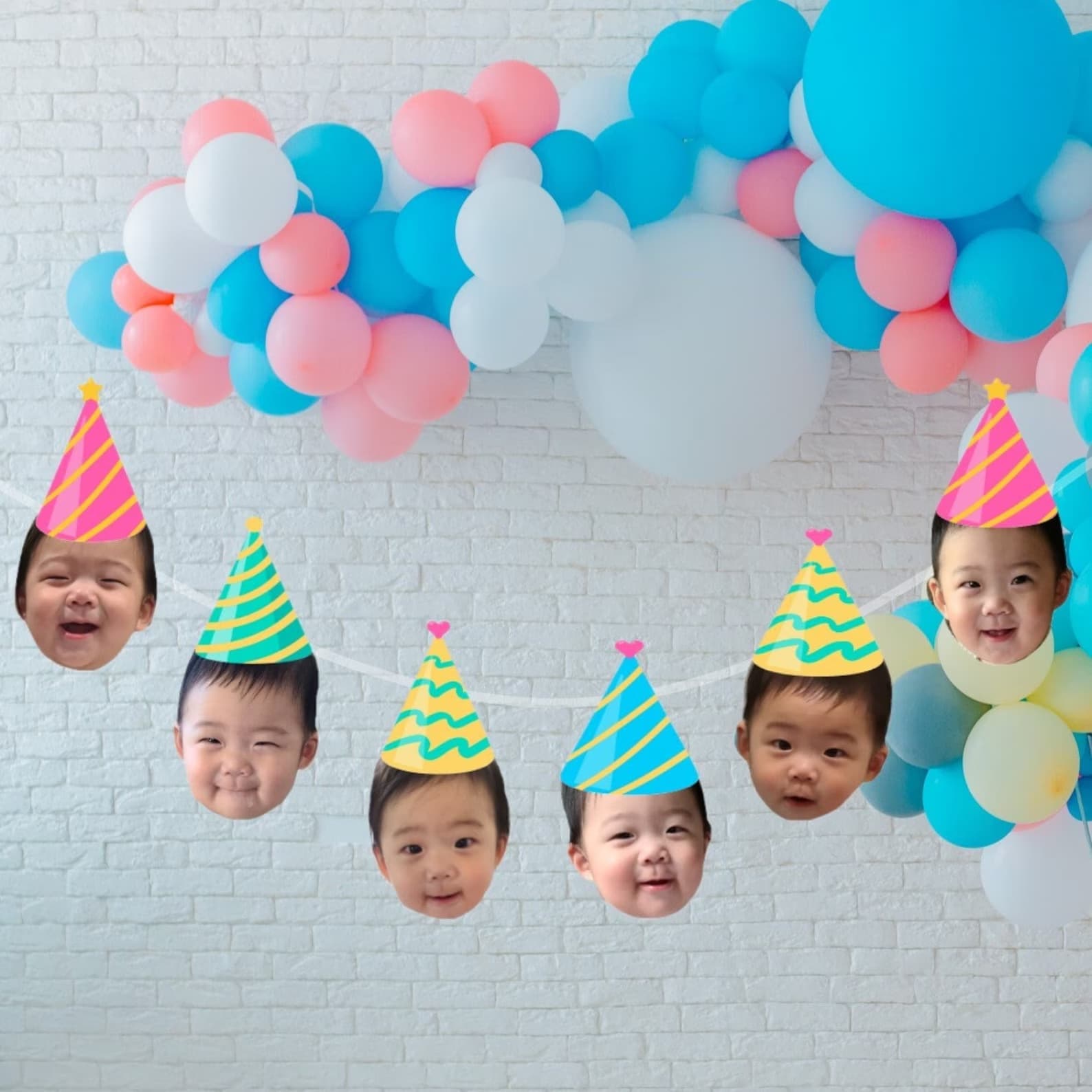 custom birthday banner with baby's face and party hats on it