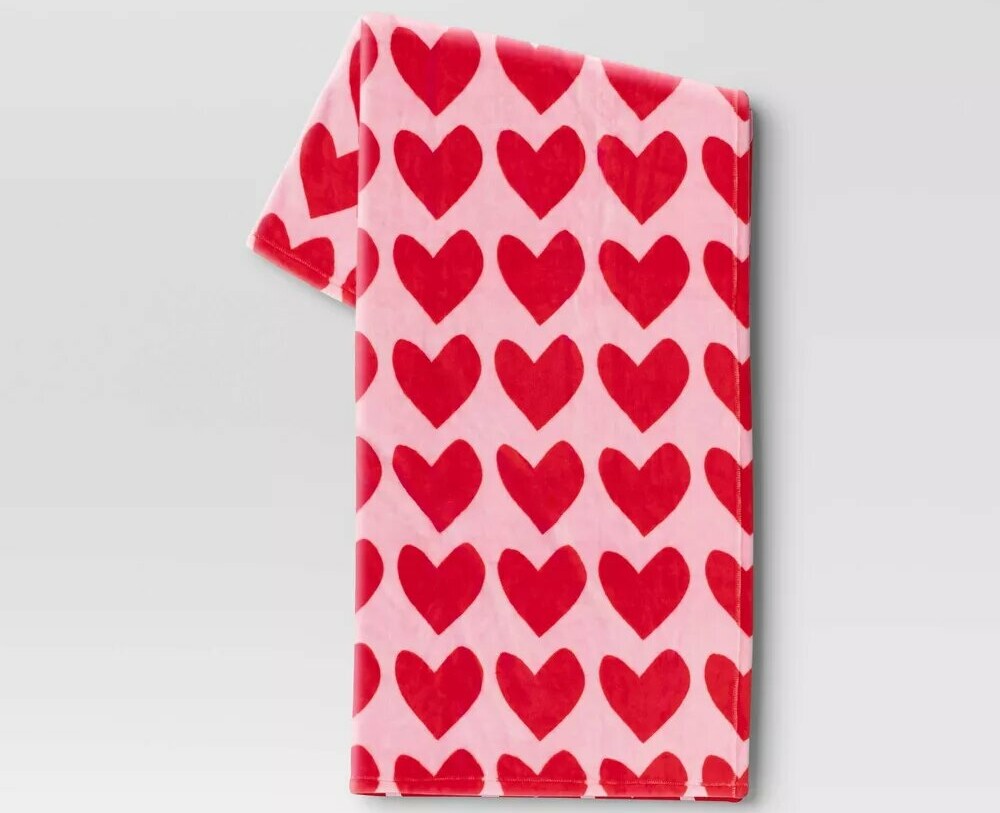 pink blanket with red hearts